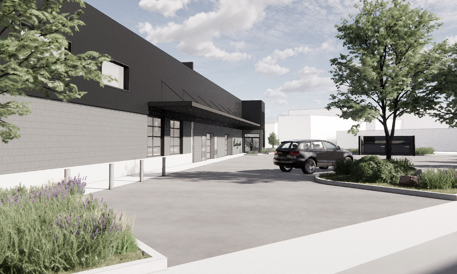Architectural rendering of a modern industrial building with black siding, concrete block, and landscaping.