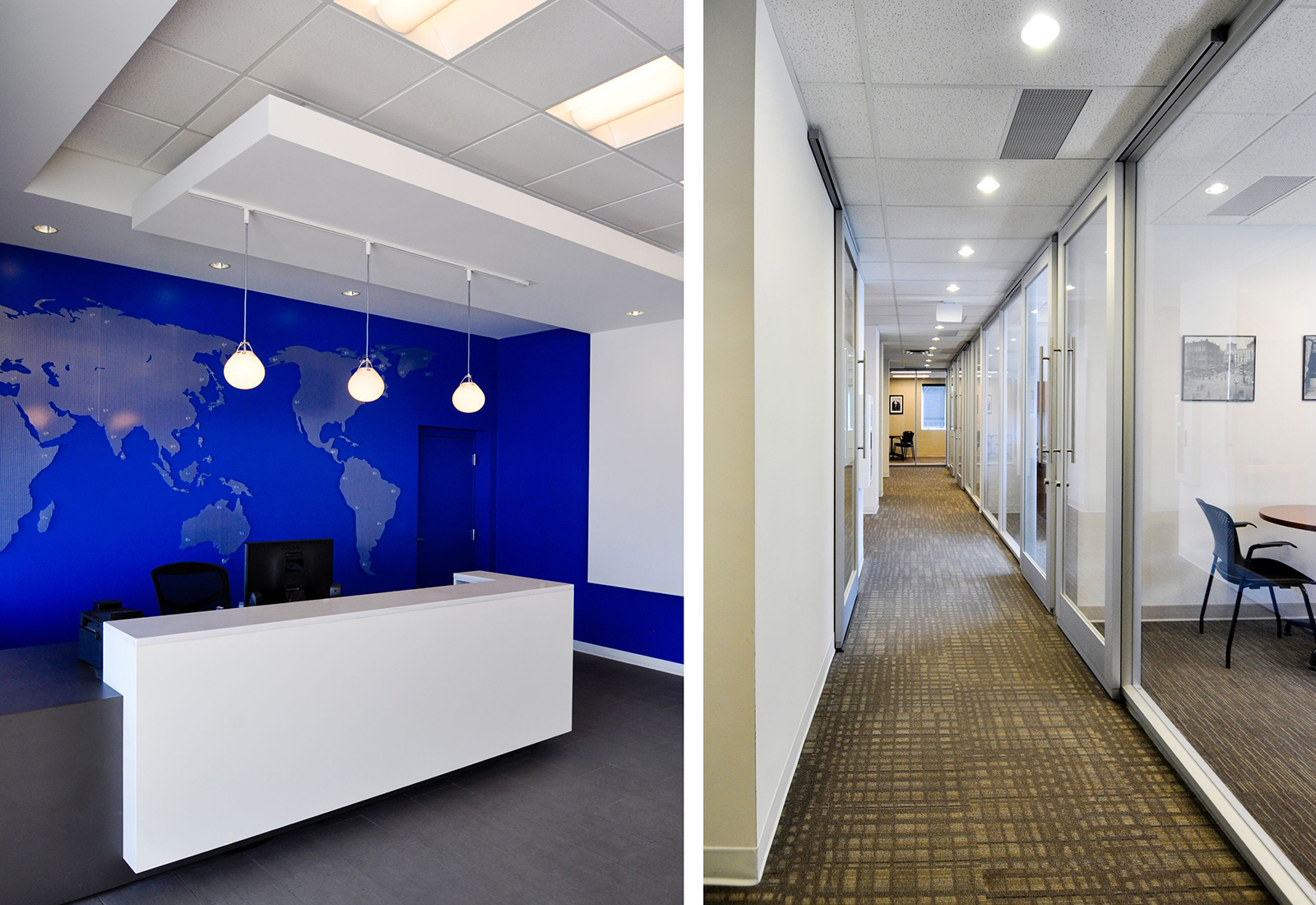 Modern office reception with a blue world map wall and a long hallway lined with glass-walled offices.