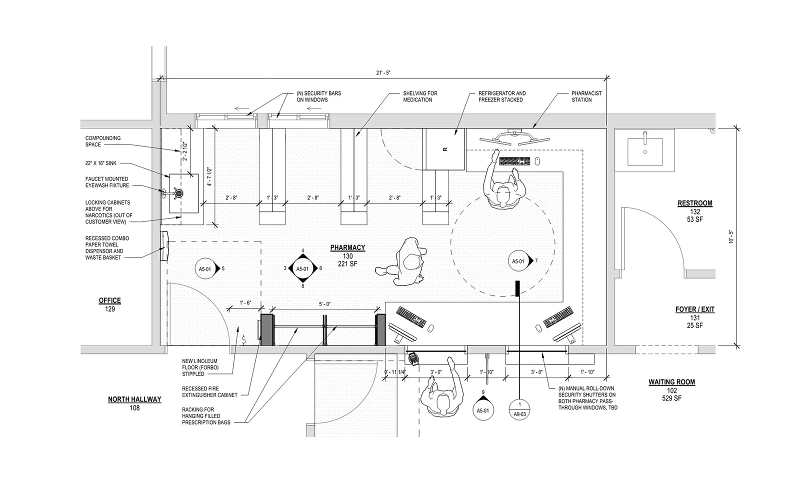 Architectural floor plan blueprint of a pharmacy layout with workspace dimensions and annotations.