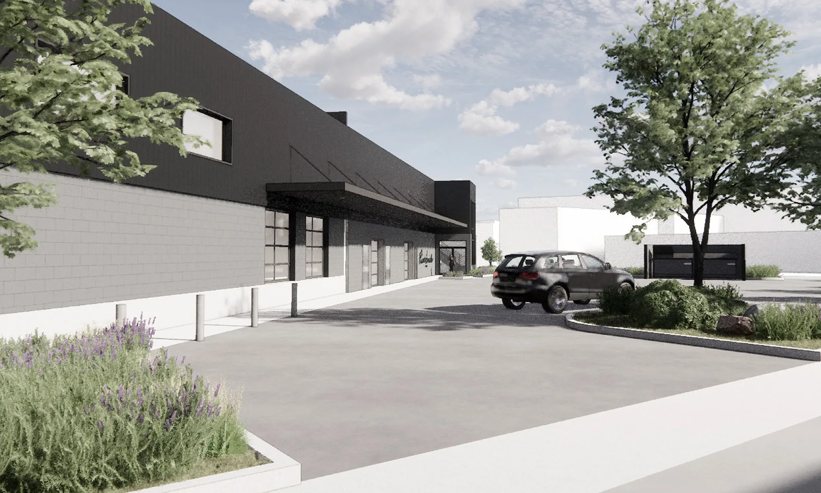 Architectural rendering of a modern industrial building with black siding, concrete block, and landscaping.