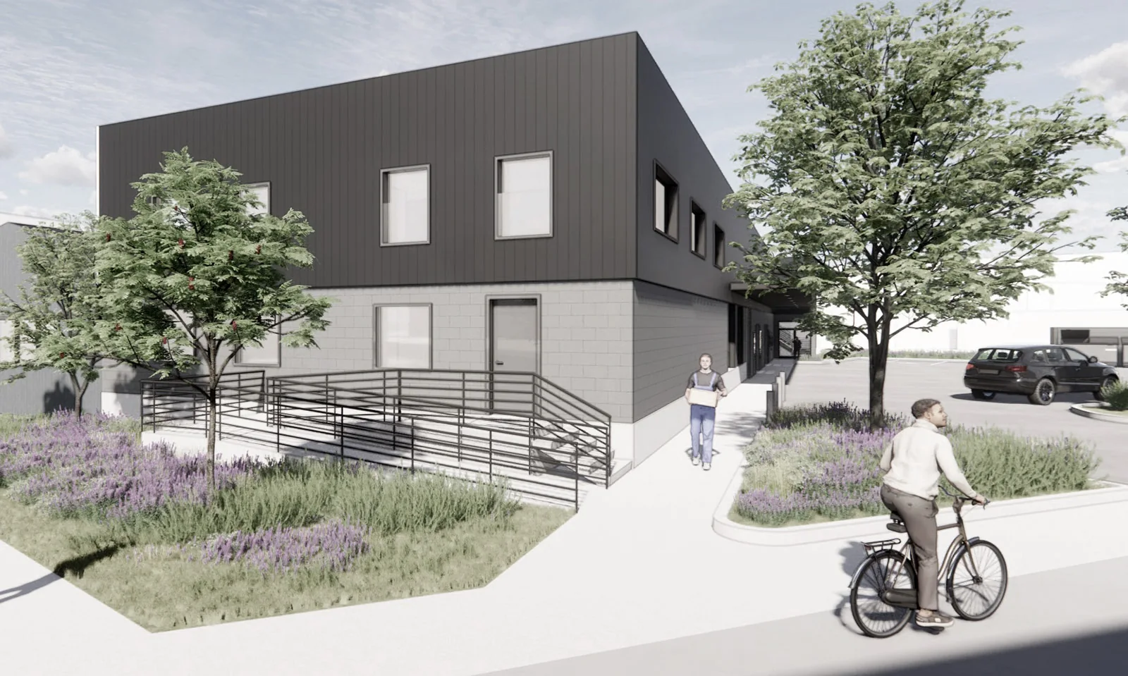 Architectural rendering of a modern two-story building with black siding, concrete block, and a landscaped ramp.